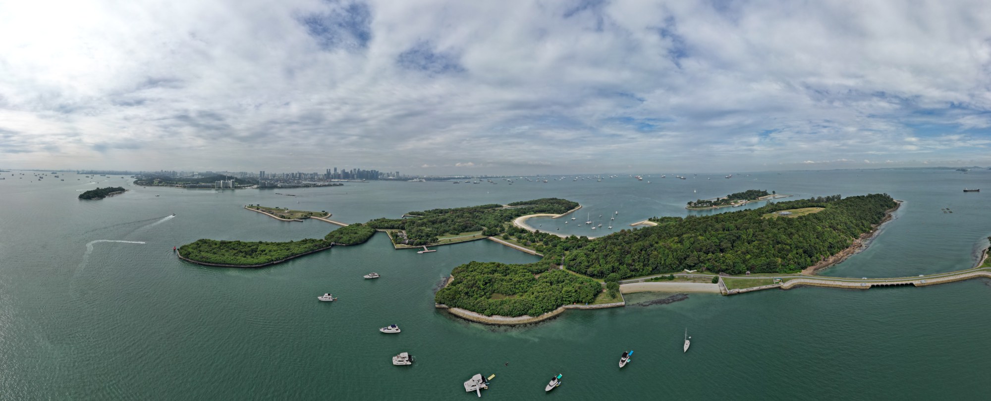 Aerial panorama of Kias, Seringat and Lazarus Islands with the Singapore city skyline in the distance